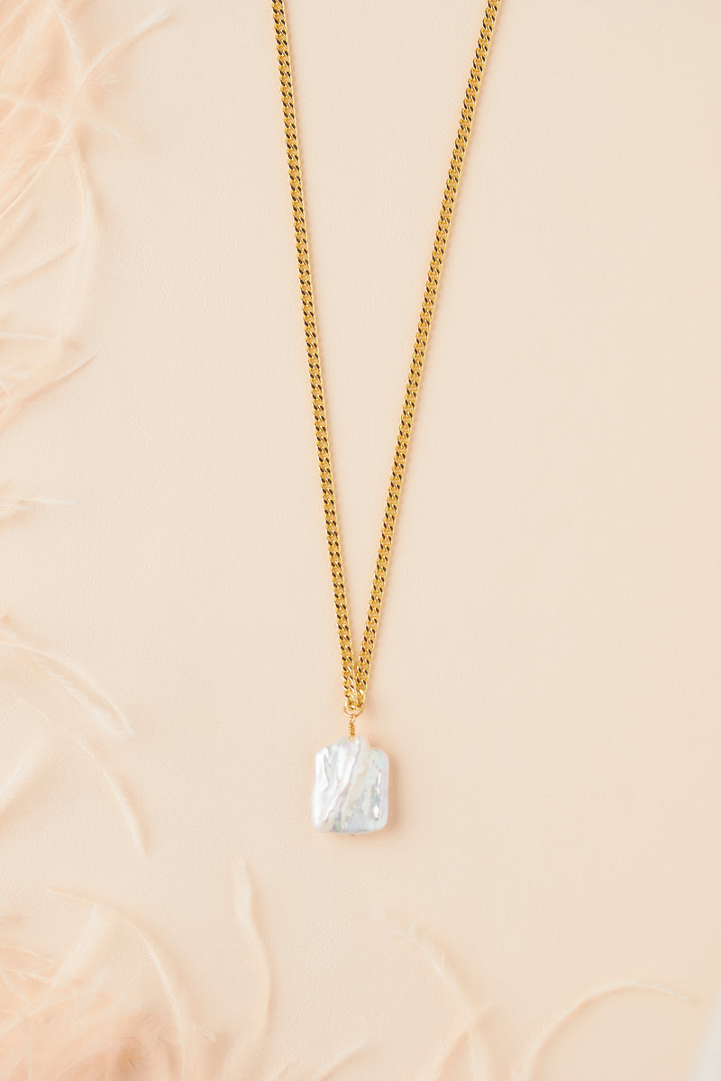 Still Wild Ariel Necklace, a rectangular freshwater pearl pendant on a gold-filled curb chain
