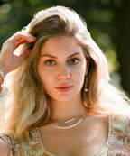 model wearing 2 still wild freshwater pearl and gold fill necklaces, one bolder one delicate and sbutle 