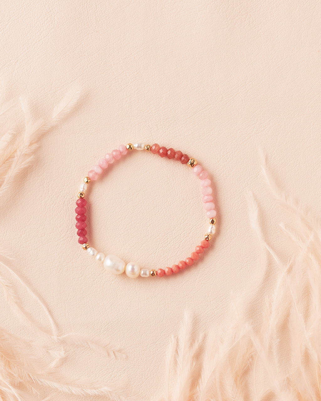 Ombre Bracelet in Rosé featuring rose jade, terracotta, and golden-filled semiprecious stones with gold-filled beads and a freshwater pearl centrepiece