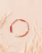 Ombre Bracelet in Rosé featuring rose jade, terracotta, and golden-filled semiprecious stones with gold-filled beads and a freshwater pearl centrepiece