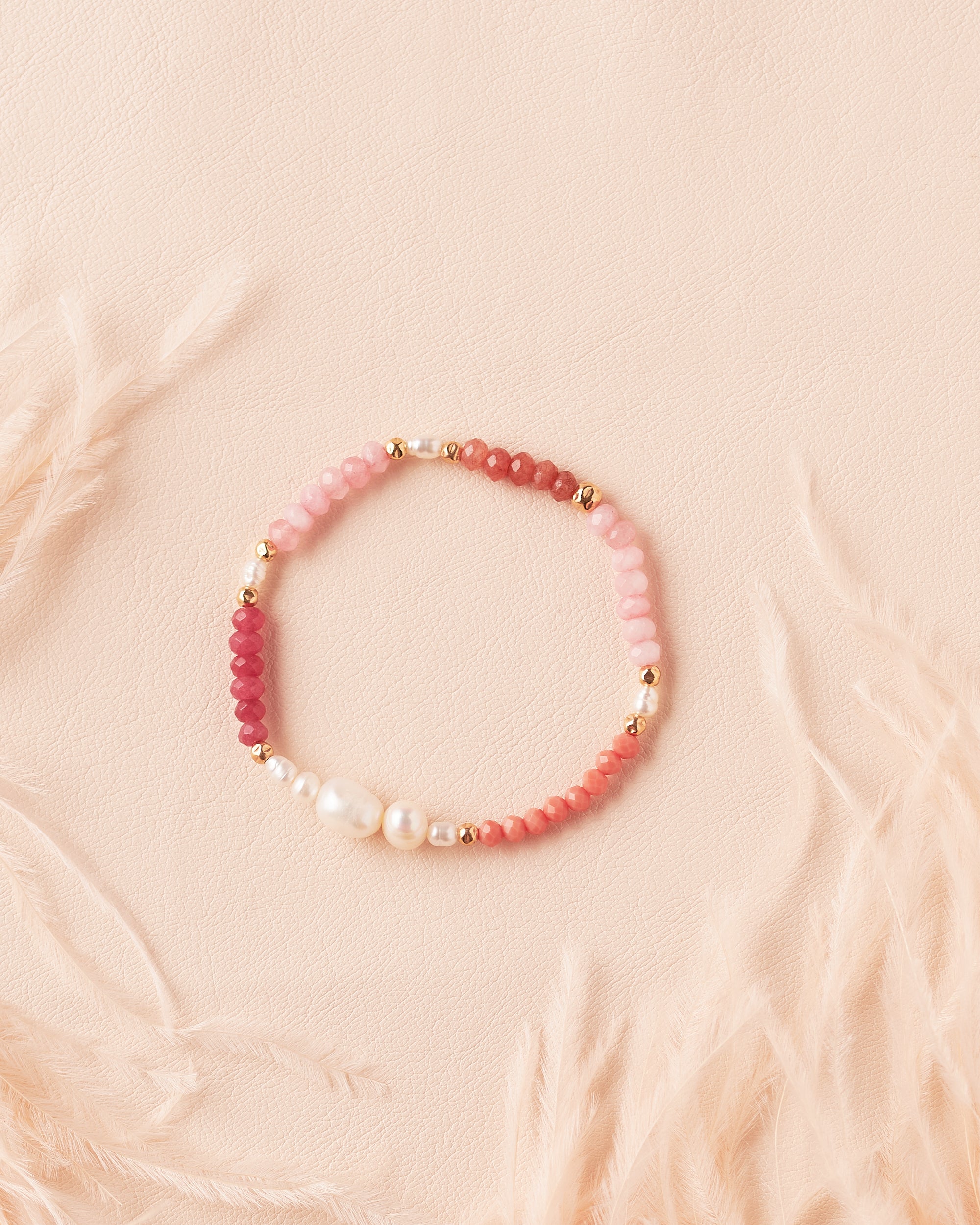 Ombre Bracelet in Rosé featuring rose jade, terracotta, and golden-filled semiprecious stones with gold-filled beads and a freshwater pearl centrepiece